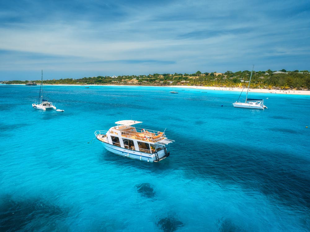 Boats floating in tropical waters
